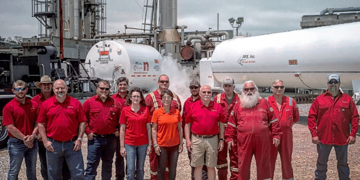 PFS team and staff in front of trucks